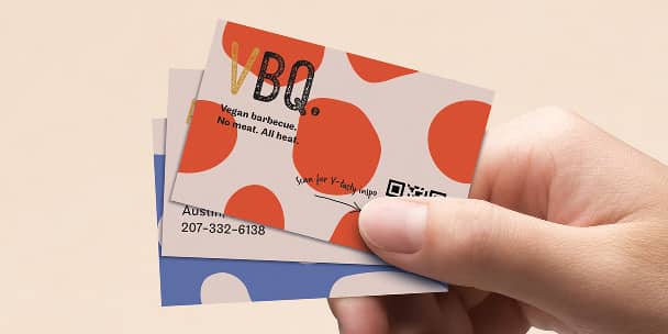 Hand holding QR Code Cards